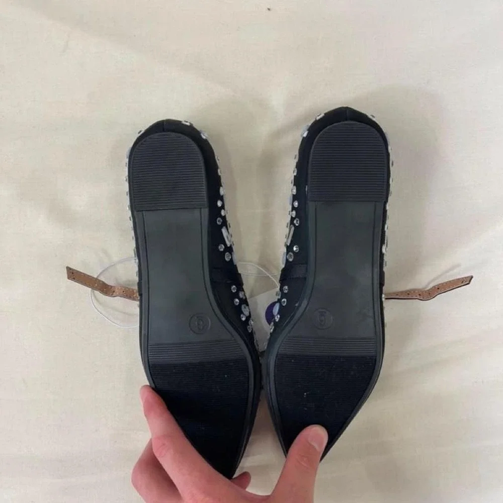 Black ballet flats with silver rhinestones and crystal embellishments